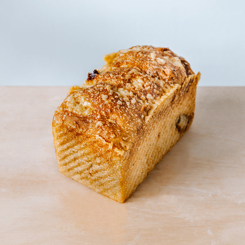 Basil Foccacia Loaf with Semi-Dried Tomatoes, Confit Garlic and Mild Cheddar 780g